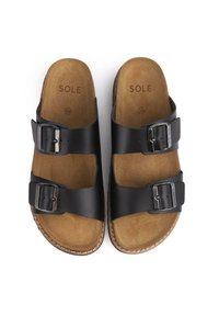 Black slide sandals with two adjustable buckles, featuring a cushioned tan footbed and stitched detailing along the edge. Size 39.