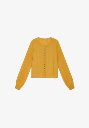 Mustard yellow cardigan in soft knit, featuring long sleeves, a rounded neckline, and a row of metallic buttons down the front.