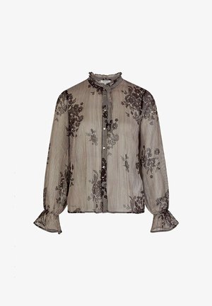 Chemisier transparent à manches longues avec rayures fines, superposition de dentelle florale noire, col et poignets volantés, et fermeture à boutons sur le devant.