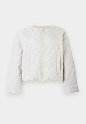 Õmmeldud, lühendatud jakk helehallis värvitoonis. Esil on lukk, ümar kaelus ja kaks küljetaskut. Sile tekstuur, tikandiga ruudukujundus.