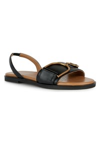 Mustat nahkaiset slingback-sandaalit, joissa on ruskea pohja. Varressa on leveä hihna ja kultainen solki. Littee pohja, jossa on reikiä hengittävyyden lisäämiseksi.