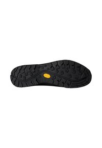 Musta Vibram-pohja, jossa on monisuuntainen päällysmuotoilu, sisältäen kohotettuja alueita pidon parantamiseksi ja keskellä näyttävän keltaisen logon.