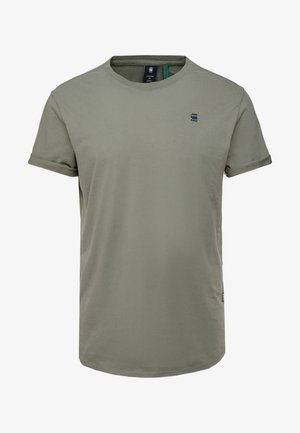 T-shirt manches courtes vert olive pour homme avec revers de manches roulés et petit logo sombre sur la poitrine gauche, étiquette taille moyenne visible à l'intérieur du col.