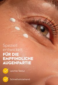 Cream applied near the eye area, shown on skin with a smooth texture. Light color, with a focus on ease of absorption.