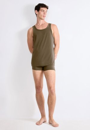 Olive green tank top and matching shorts, made from a smooth, lightweight fabric, featuring a fitted design and minimal stitching details.