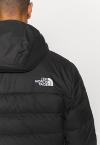 The North Face ACONCAGUA HOODIE - Casaco de penas - black