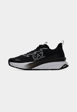 Black and white Emporio Armani EA7 running shoe with thick sole, lace-up front, and "Sonic" branding on a plain background.