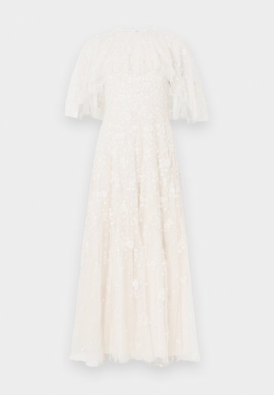 Fehér, hosszú, légies ruha texturált, hímzett felsőrésszel és áttetsző, puffos ujjakkal. Virágmintákkal és flitterekkel díszítve.