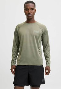 Langdurige sporttop met lange mouwen in olijfgroen, van gestructureerde stof met een ronde hals en raglanmouwen. Heeft een klein wit merkenlogo op de borst.