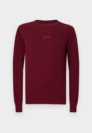 Bordeauxrotes langärmeliges Ripp-T-Shirt mit rundem Ausschnitt und gesticktem "GAP"-Logo auf der Brust. Weiche Textur mit eng anliegenden Bündchen.