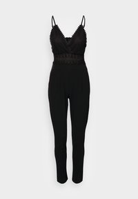Svart ärmlös jumpsuit med spetsdetaljer på den figursydda bodice, justerbara spaghettistraps och tapered byxor.