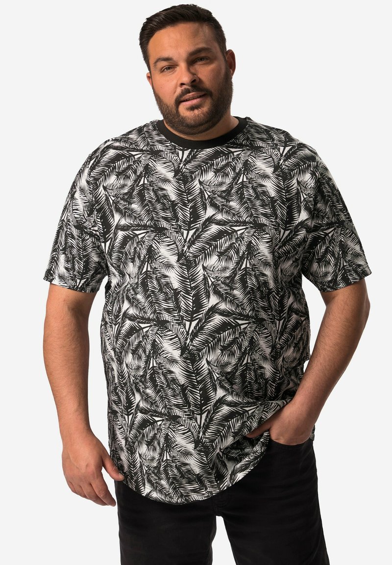 Short-sleeve black and white shirt featuring a palm leaf pattern, made from lightweight fabric; round neck design with a relaxed fit.