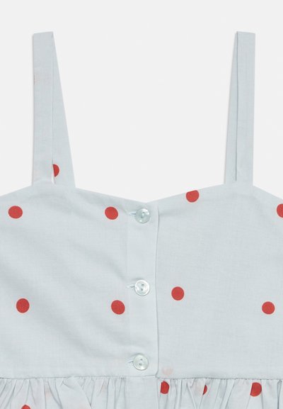 Λευκό αμάνικο φόρεμα με κόκκινες πουά, κουμπιά στο μπροστινό μέρος και λεπτομέρεια με σούρα στη μέση.