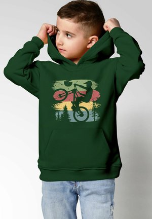 Green hooded sweatshirt featuring a graphic of a cyclist performing a stunt with silhouette details against a gradient background.