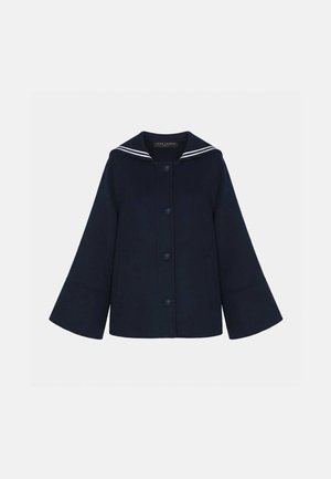 Veste bleu marine boutonnée avec manches larges et col style marin orné de deux bandes blanches.