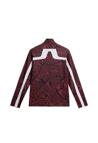 Långärmad jacka med ett mönster i röd och svart med vita accenter och en hög krage, tillverkad av ett slätt och andningsbart tyg.