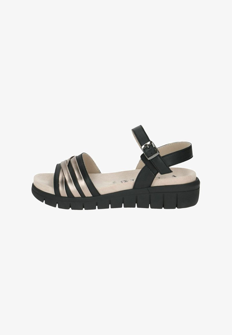 Sandales noires avec trois lanières métalliques bronze, bride de cheville ajustable, et une semelle noire épaisse, dotées d'une semelle intérieure texturée.