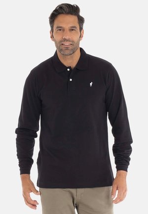 Polo à manches longues noir en coton, avec une patte de boutonnage à deux boutons et un logo brodé blanc sur la poitrine gauche.
