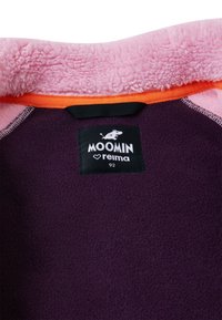 Fleece garment with a pink collar and orange trim. Dark purple fabric inside. Tag shows "Moomin" and "Reima," size 92. Soft texture.