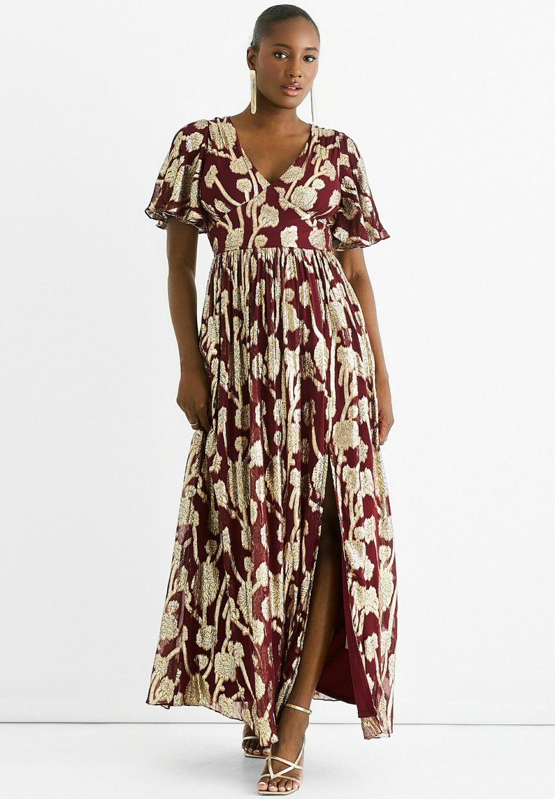 Maxi dress in burgundy with gold floral pattern, featuring a deep V-neck, short flutter sleeves, and a side slit, made from lightweight fabric.