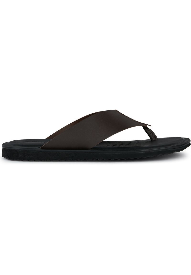 Sandalias de playa marrones con correas flexibles y una suela de goma negra texturizada. El diseño presenta un estilo minimalista con una construcción ligera.
