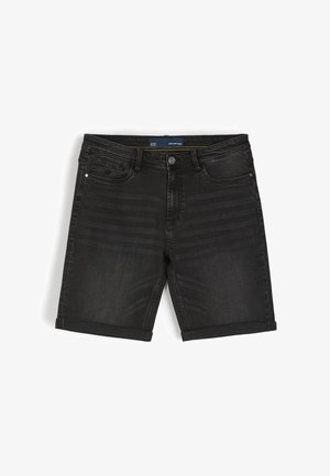 Czarne szorty dżinsowe o regularnym kroju, z podwiniętymi mankietami, pięcioma kieszeniami i subtelnym efektem sprania. Zamek błyskawiczny oraz zapięcie na guzik.