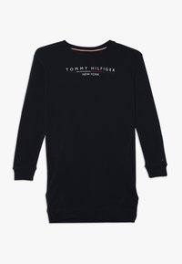 Granatowa bluza z długim rękawem i okrągłym dekoltem, z białym logo "TOMMY HILFIGER NEW YORK". Posiada boczne kieszenie i ściągacze przy mankietach.