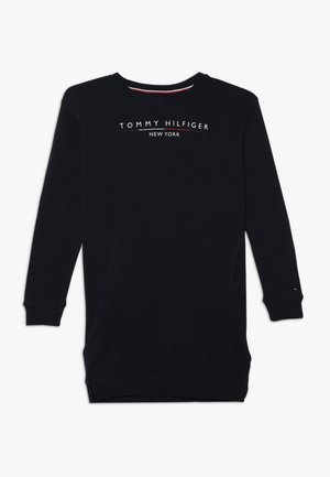 Mörkblå sweatshirt med lång ärm och rundad hals, med vit "TOMMY HILFIGER NEW YORK"-logotyp. Inkluderar sidofickor och ribbade ärmslut.