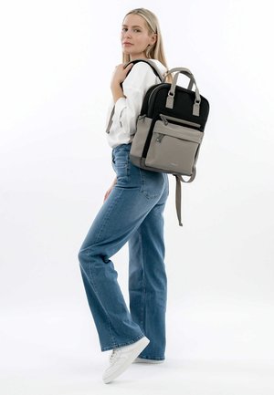 Black and gray two-tone backpack, rectangular shape, fabric material, multiple front pockets, adjustable straps, carry handles on top.