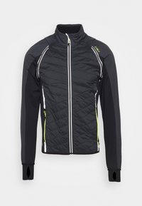 Veste noire isolante avec texture matelassée, manches noires contrastantes, zips blancs et accents verts. Présente des ouvertures pour les pouces et un col haut.