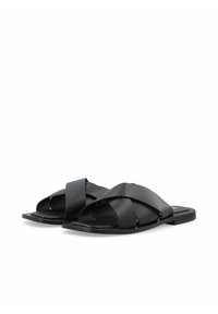Sandali slide in pelle nera con cinturini incrociati, suola piatta e superficie liscia. Design semplice senza decorazioni visibili.