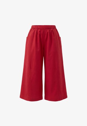 Røde vide cropped bukser med elastisk talje og sidelommer, vist mod en ensfarvet hvid baggrund.