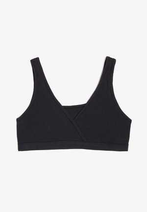 Zwarte pullover bh gemaakt van een zachte katoenmix. Heeft brede banden en een kruisvormig ontwerp aan de voorkant. Naadloze randen en rekbare stof voor comfort.