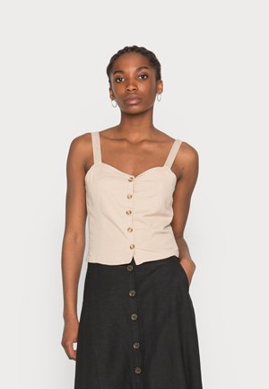 Camisola de linho bege com formato ajustado, com alças largas, decote coração e botões castanhos ao longo do centro.
