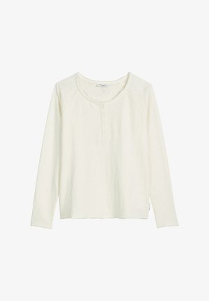 Crèmekleurige top met lange mouwen, een ronde halslijn, drie knopen aan de voorkant en een losse pasvorm. Gemaakt van een gestructureerd, zacht materiaal met raglanmouwen.