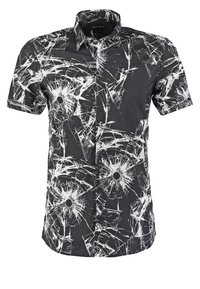 Chemise noire à manches courtes boutonnée avec motif de verre brisé blanc et points noirs au centre de chaque motif brisé.