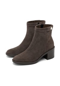 Brown suede ankle boots with a round toe, a low block heel, and a zip closure. Features a cuffed top with a decorative accent button.