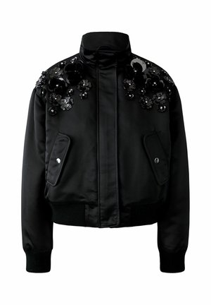 Schwarze Bomberjacke aus Satin mit floralen Verzierungen. Mit hohem Kragen, Reißverschluss vorne sowie gerippten Bündchen und Saum.