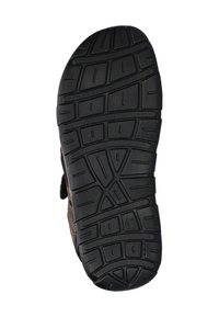 Zwarte rubberen zool met diepe profiel, met ribbels en patronen voor grip. Bruine synthetische bovenkant zichtbaar aan de zijkanten. Maat 41 gemarkeerd.