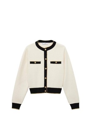 Cardigan blanc avec des accents noirs, fermetures à boutons dorés, deux poches thoraciques et des poignets et un ourlet côtelés. Texture douce, design classique.