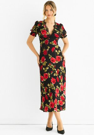 Floral midi dress in black with red and green flower patterns, featuring puff sleeves and a v-neckline. Smooth fabric, fitted silhouette.