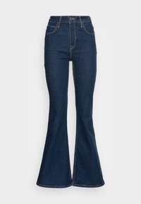 Jeans a zampa d'elefante in denim scuro con vita alta, design a cinque tasche e cuciture gialle a contrasto lungo le cuciture.