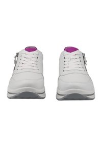White athletic shoes with textured leather, prominent lacing, purple interior accents, and silver hardware on the outer side.