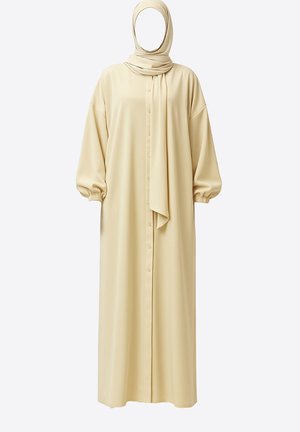 Long, beige dress with puffed sleeves, button front, and matching scarf. Soft fabric with a smooth texture and relaxed silhouette.