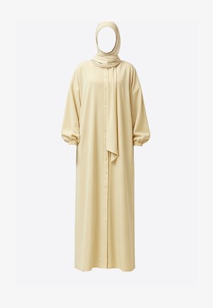 Long, beige dress with puffed sleeves, button front, and matching scarf. Soft fabric with a smooth texture and relaxed silhouette.