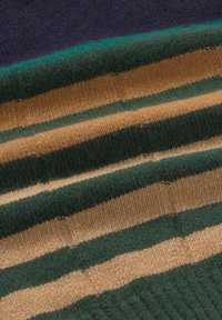 Striped fabric in dark purple, green, and beige. Features soft texture and ribbed design with alternating wide and narrow stripes.