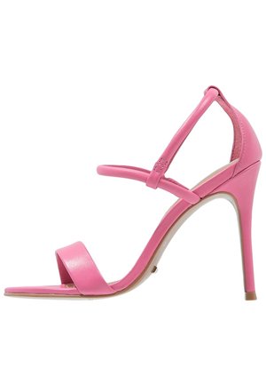 Sandale à talon haut rose avec une finition élégante et brillante. Dotée de fines lanières et d'un design minimaliste. Talon aiguille surélevé.