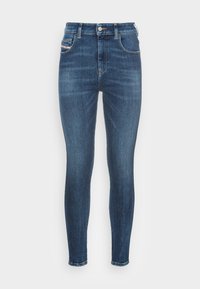 Smala denimjeans i mörkblå tvätt, med fem fickor, metallknappstängning och diskreta sömdetaljer längs sömmarna.