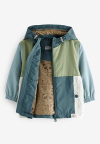 Veste colorée avec un mélange de panneaux verts, bleus et blancs. Design à capuche avec une doublure intérieure à motifs ornée d'ours.