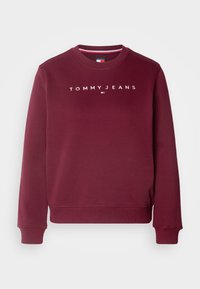Sweat-shirt bordeaux à manches longues et col rond avec le texte "TOMMY JEANS" et un petit logo centré sur la poitrine, avec poignets et ourlet côtelés.
